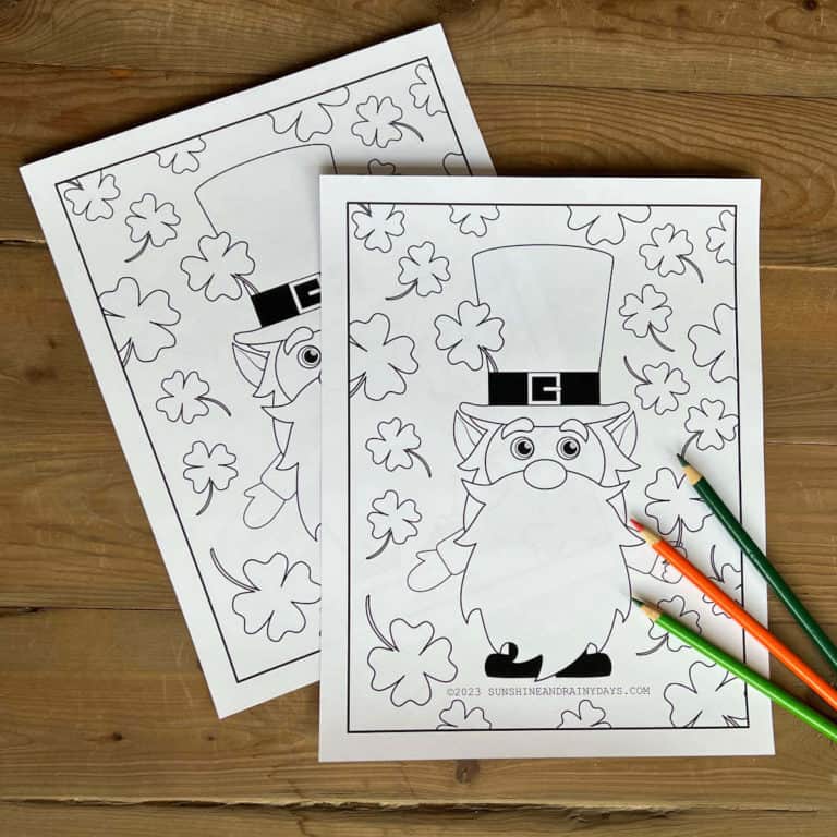 Two copies of a St. Patrick's Day coloring page with three colored pencils.