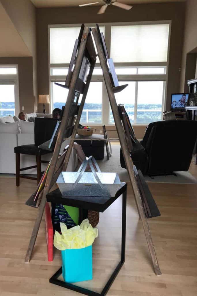 Basket on a table for cards and gifts at a graduation party.