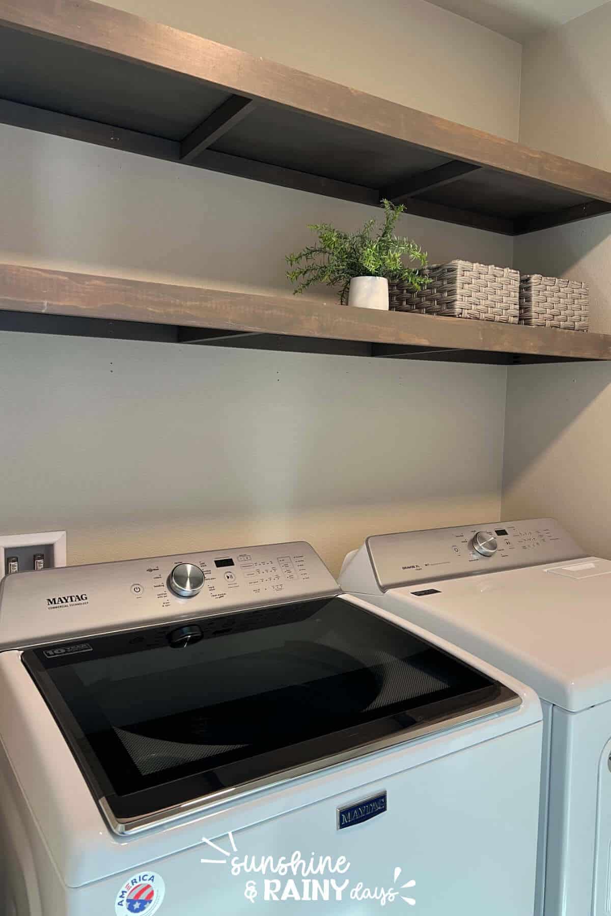 Laundry room with DIY shelves above the washer and dryer.