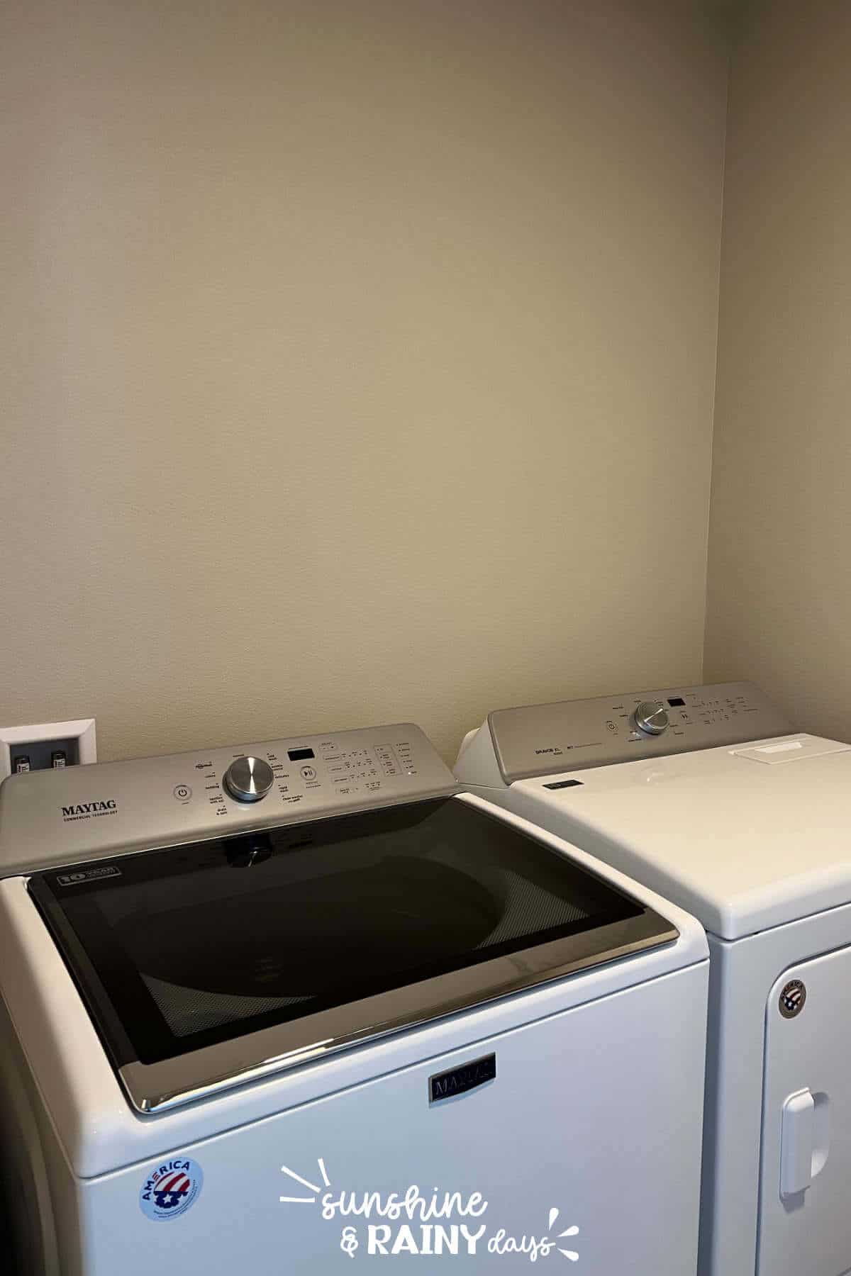 Washer and dryer without any shelving above it.