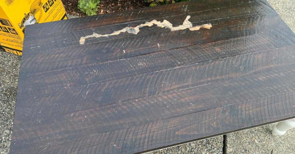 Damaged coffee table top.
