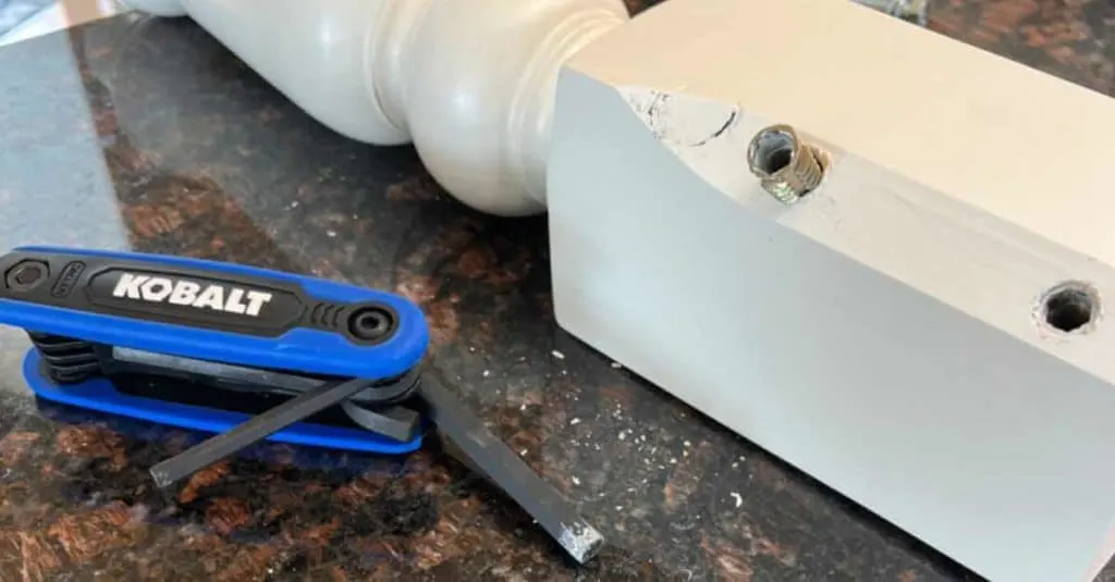 Removing wood insert nuts from a coffee table leg.