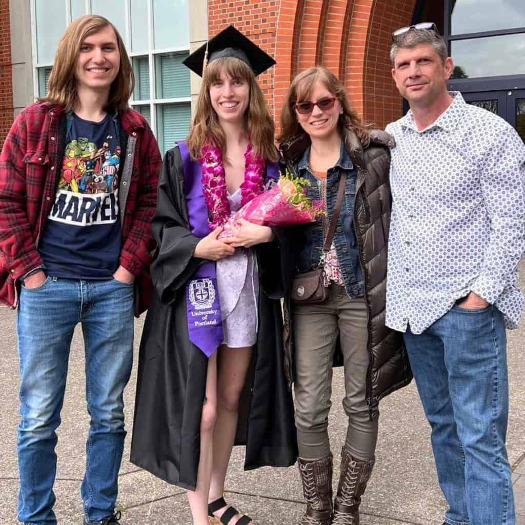 Family picture with a college graduate on graduation day.