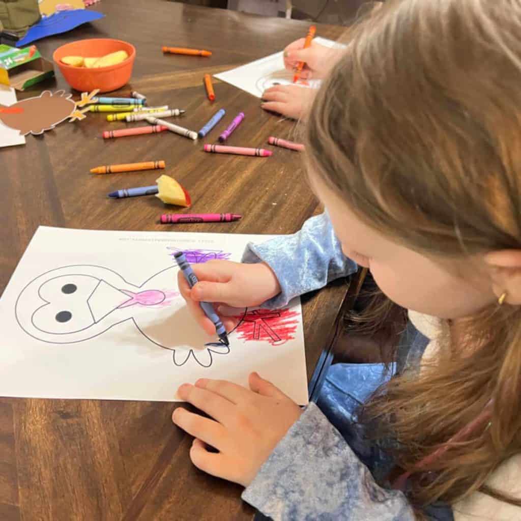 Pre-schooler coloring a turkey.