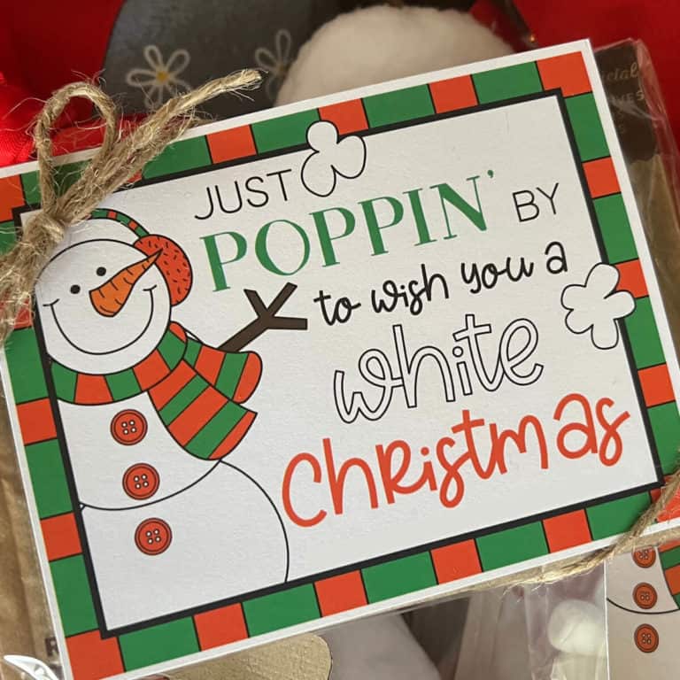 Picture of a printable White Christmas tag tied to a bag of microwave popcorn.