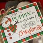Just Poppin' By To Wish You A White Christmas tag on a bag of microwave popcorn.