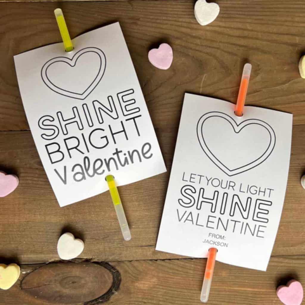 Glow sticks attached to Valentine tags that say: Shine Bright Valentine and Let Your Light Shine Valentine
