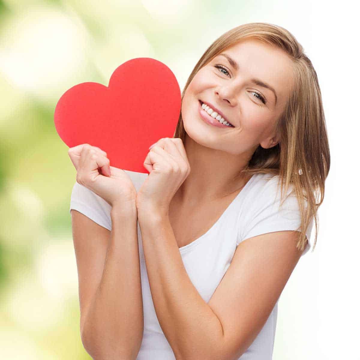 Young girl holding a Valentine heart.