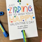 Zipper bracelet attached to a printable Valentine that says Just Zipping By To Wish You A Happy Valentine's Day.