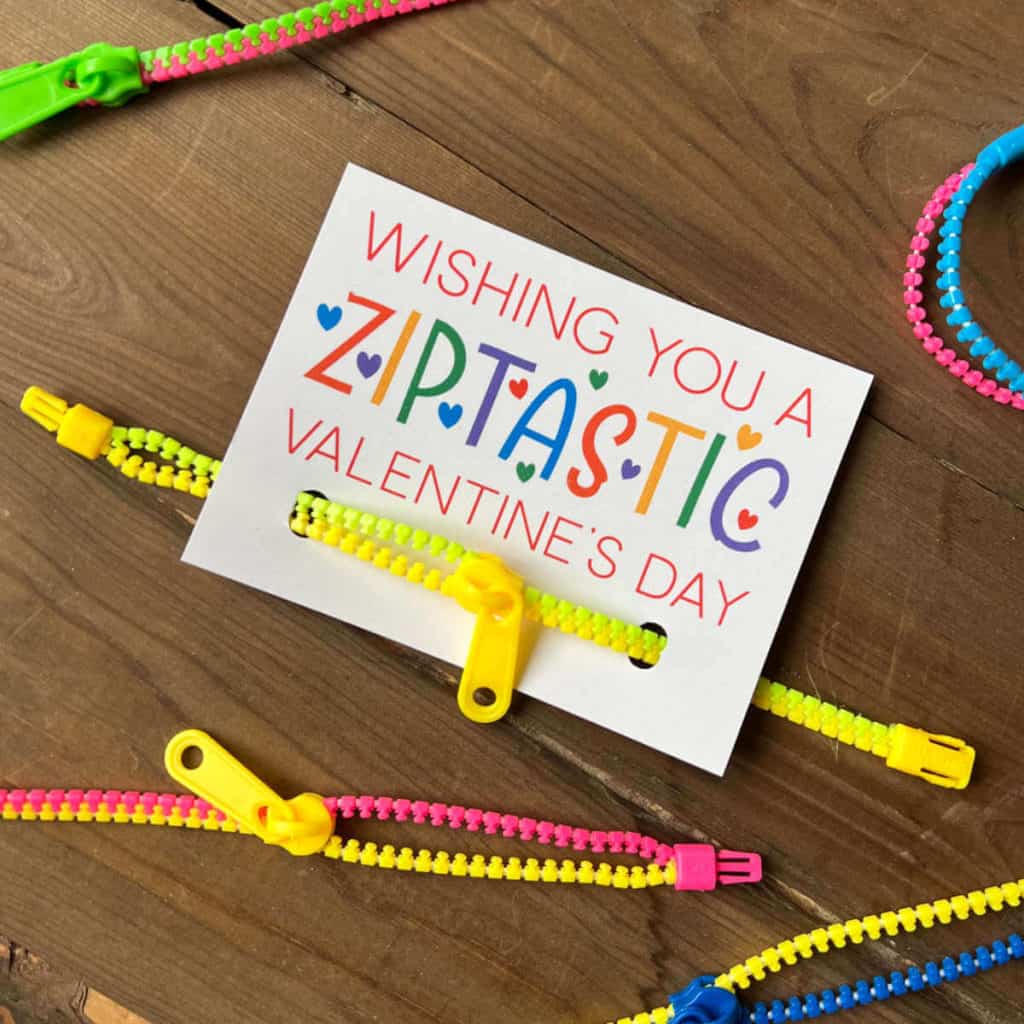 A zipper bracelet attached to a Valentine that says: Wishing You A Ziptastic Valentine's Day.