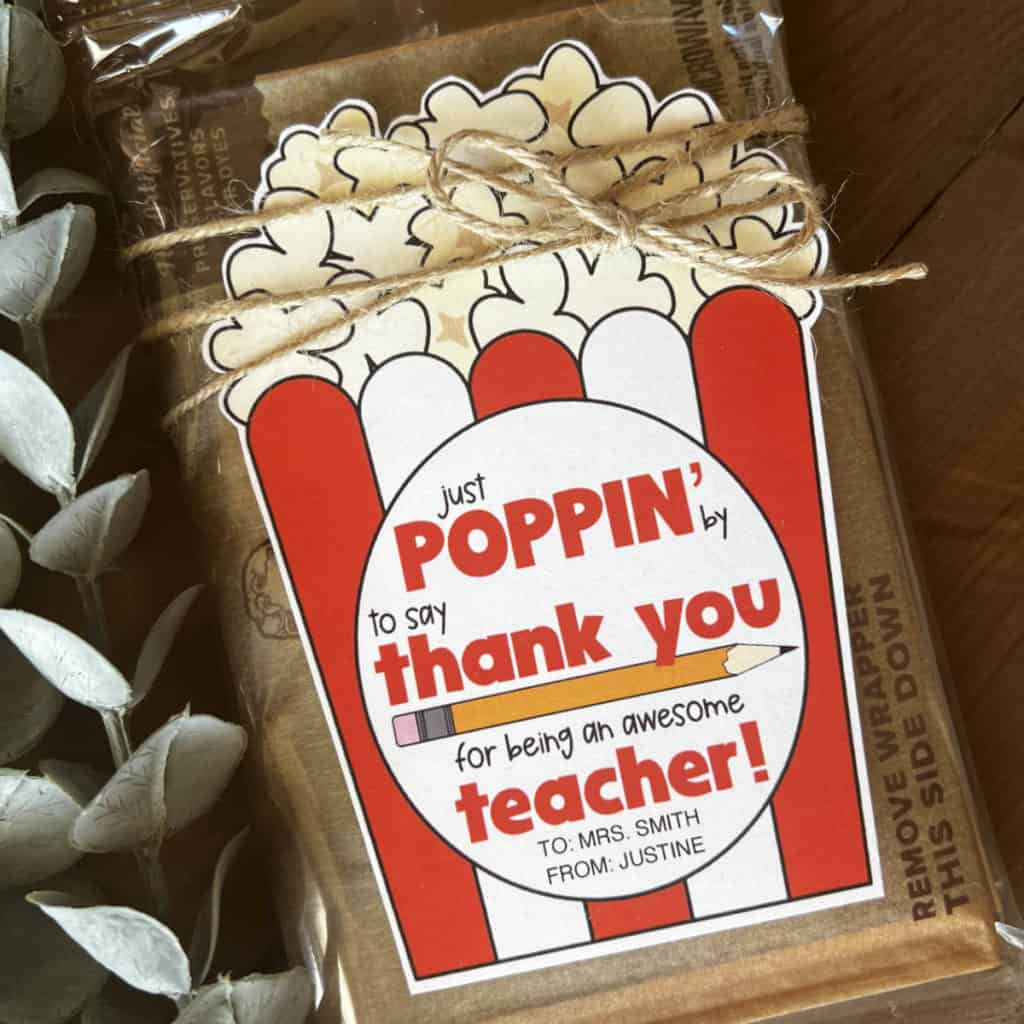 Teacher appreciation popcorn gift tag on microwave popcorn.