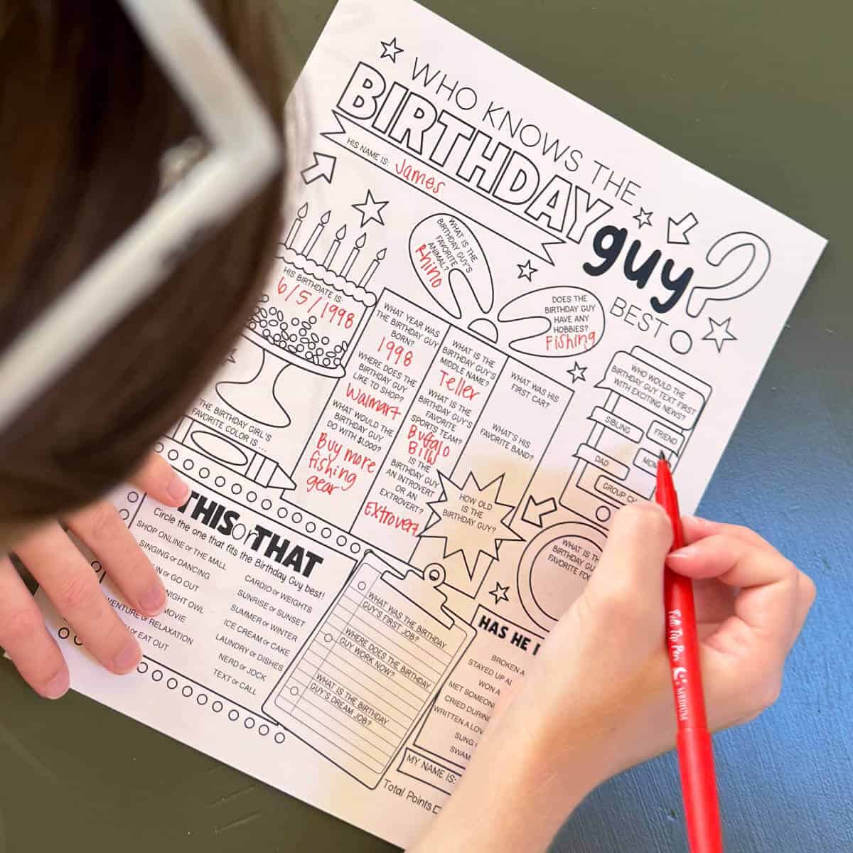 Girl at a table filling out a printable game with the title, Who Knows The Birthday Guy Best.