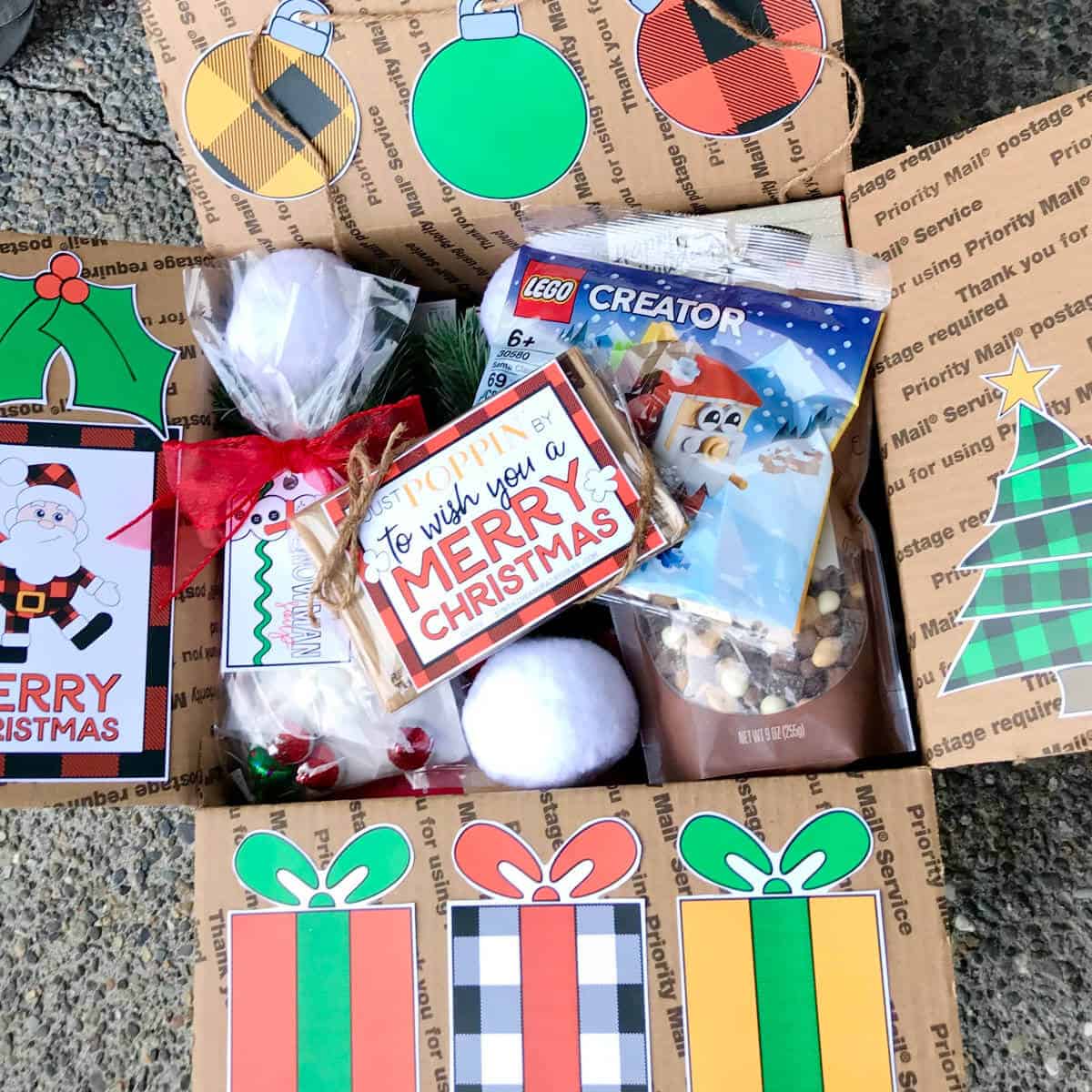 Box full of Christmas fun with the box flaps decorated with Christmas Printables.