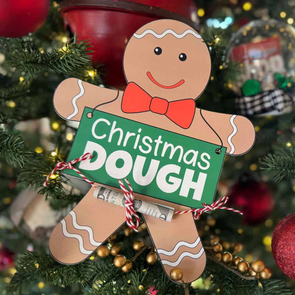 Gingerbread man money holder that says Christmas Dough.