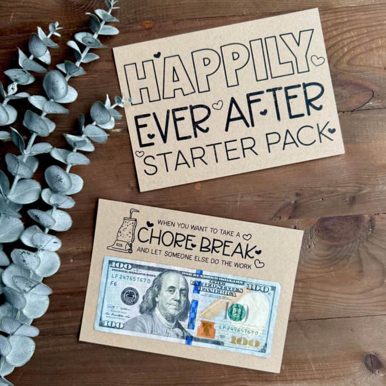 Two pages printed that say Happily Ever After Starter Pack and Chore Break with a fake plant nearby.