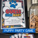 Image of a puppy-themed Guess How Many sign in an 8-1/2 x 11" frame next to a jar full of bone-shaped treats.